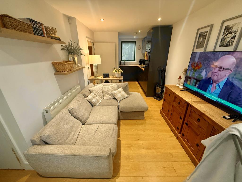 Lot: 57 - WELL PRESENTED THREE-BEDROOM HOUSE FOR INVESTMENT - Living room and kitchen